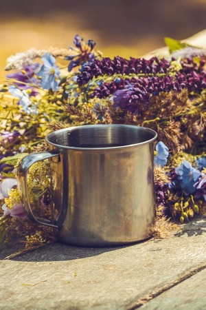 bouquet of spring flowers and a cup on the table filter,の写真素材