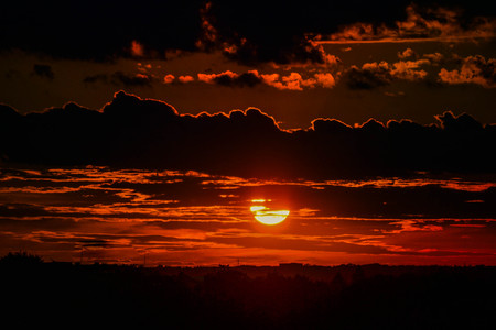 dark sunset sunrise with dark clouds with horizonの写真素材
