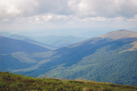 Carpathian mountain landscape with fog, haze filterの写真素材