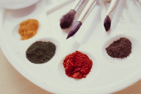 paint pigment powder poured in a paletteの写真素材
