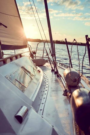 white deck of a yacht during sunset with filterの写真素材