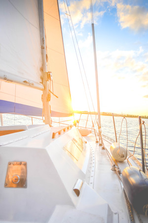 white deck of a yacht at sunset dawn with filterの写真素材