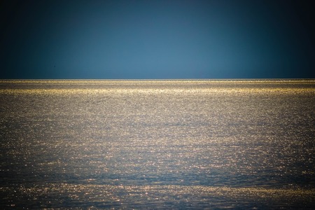 background reflection of the sun the sea and the skyの写真素材