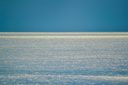background reflection of the sun the sea and the skyの写真素材