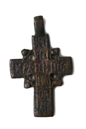 ancient cross on the neck isolated on white backgroundの写真素材