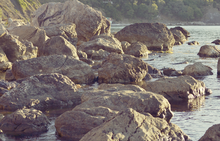 abstract background of huge stones on the shore, filterの写真素材