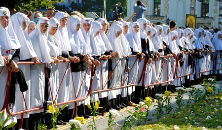 Kiev, Ukraine, celebration liturgy in honor of the baptism of Rus in Kiev Pechersk Lavra - 27 July 2013 -: Sisters of Mercy standing near the fence, head bowedのeditorial素材