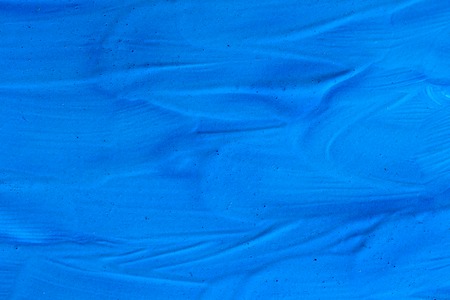 abstract background blue surface of dried paint. Textured, close-upの写真素材