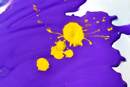 deliquescent yellow blotch on the purple paint on a white backgroundの写真素材