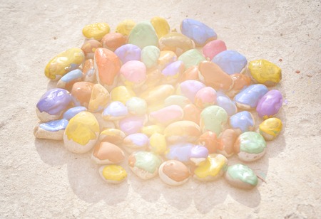 Abstract creative background close-up. Stones with a smooth surface painted with colorful paintの写真素材