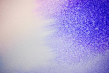 Blue and pink ink on white paper conveyed over close-up. Figure drawing resembles frost on the window, snowflakeの写真素材