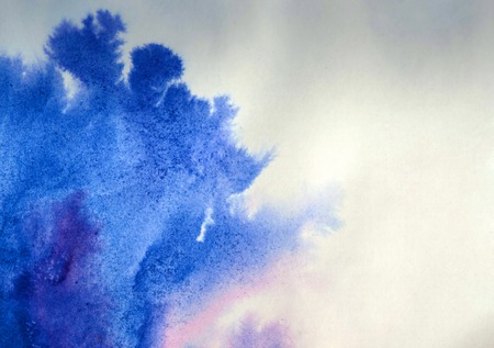 ink spot spreads on paper blue colorの写真素材