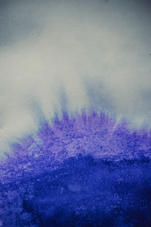 ink spot spreads on paper blue colorの写真素材