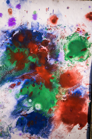 drops with streaks of different colors of paint are mixedの写真素材