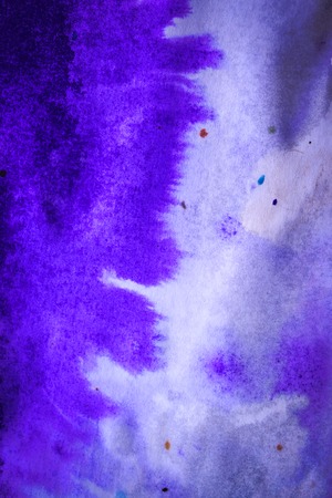 abstract purple ink stains with streaks on white wet paperの写真素材
