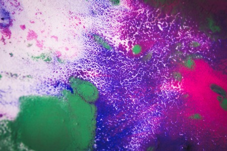 Multicolored paint stains, drips, splashes, mixing. Abstract colorful backgroundの写真素材