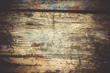 old shabby wooden surface close up with cracked paintの写真素材