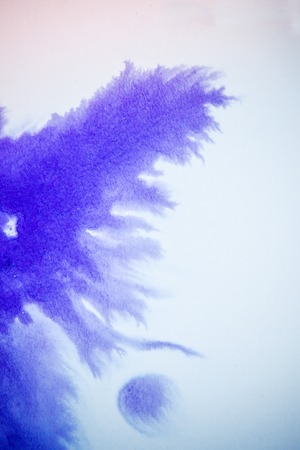 Ink purple drops and splatters on white background