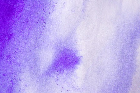Purple ink stain on a sheet of white paper macro. Abstract background. Spreads ink stains with streaks on a white backgroundの写真素材