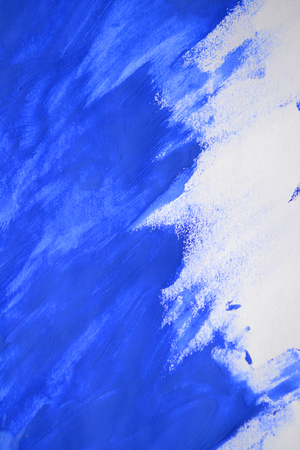 brushstrokes of blue paint made by a fingerの写真素材