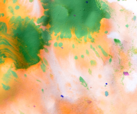 Warm abstract background red, yellow, orange ink spot swith green drops on white paperの写真素材