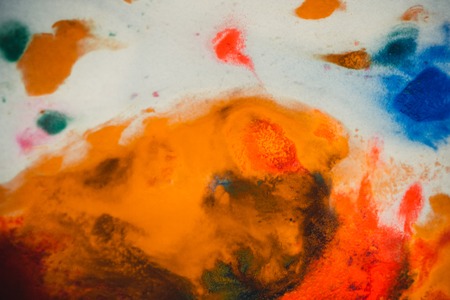 Whirlwind vortex spreads colored ink colors on white background. Abstractly spreads dye ink red, green, yellow, orange, blue background on paper. Art Creative abstract background. Colorful backgroundの写真素材