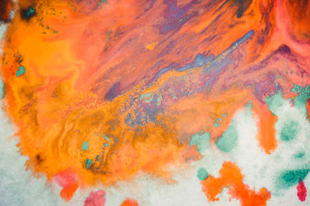 Whirlwind vortex spreads colored ink colors on white background. Abstractly spreads dye ink red, green, yellow, orange, blue background on paper. Art Creative abstract background. Colorful backgroundの写真素材