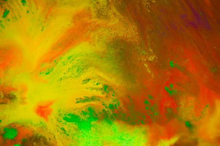 Whirlwind vortex spreads colored ink colors on white background. Abstractly spreads dye ink red, green, yellow, orange, blue background on paper. Art Creative abstract background. Colorful backgroundの写真素材