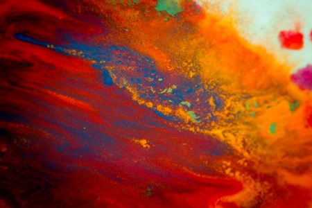 Whirlwind vortex spreads colored ink colors on white background. Abstractly spreads dye ink red, green, yellow, orange, blue background on paper. Art Creative abstract background. Colorful backgroundの写真素材