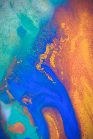 spreads colored ink colors on white background. Abstractly spreads dye ink red, green, yellow, orange, blue background on paper. Art Creative abstract background. Colorful backgroundの写真素材