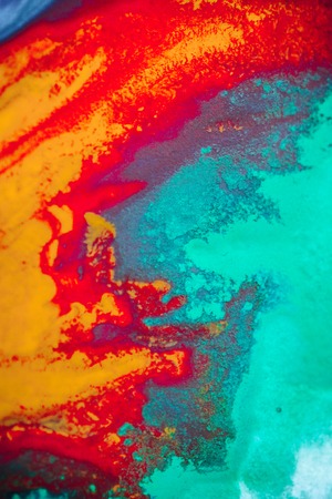 spreads colored ink colors on white background. Abstractly spreads dye ink red, green, yellow, orange, blue background on paper. Art Creative abstract background. Colorful backgroundの写真素材