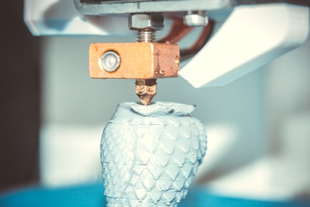 HD 1080 3D printer prints, creates, pouring, yellow a figure, shape of plastic, close-up. 3D printer...