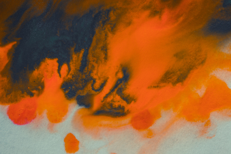 overflowing bright orange and dark blue paint on paper. Shabby style abstract faded background. Mixing paints close-up. Abstract base backdrop abstract background backdrop framework for creativity artの写真素材