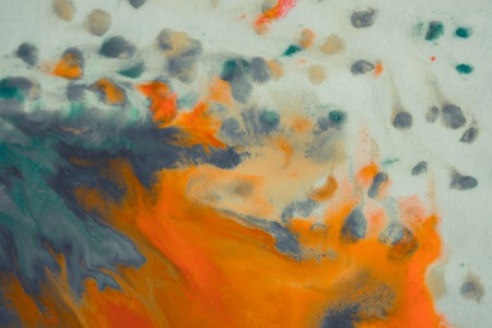 overflowing bright orange and dark blue paint on paper. Shabby style abstract faded background. Mixing paints close-up. Abstract base backdrop abstract background backdrop framework for creativity artの写真素材