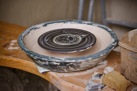 An empty circle, where the potter molds product. Creative studio potter. Workplace wizard Crock potteryの写真素材