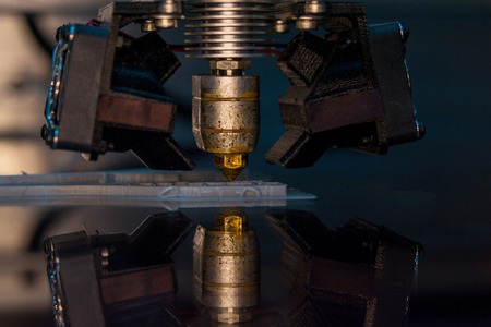 3D printer print isolated objects on mirror reflective surface close-up. Modern 3D printing technologyの写真素材