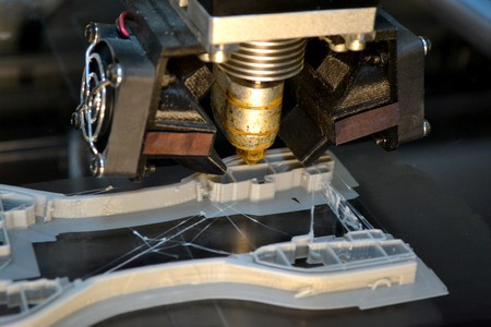 3D printer print isolated objects on mirror reflective surface close-up. Modern 3D printing technology. Top viewの写真素材