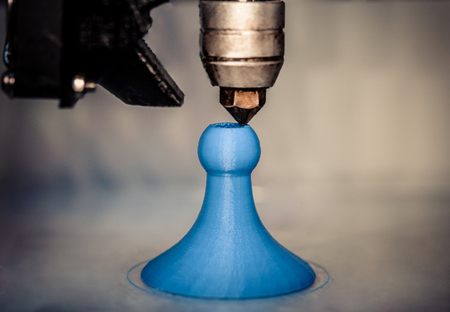 Modern 3D printer printing figure close-up macro.Automatic three dimensional 3d printer performs...