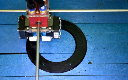 Work 3d printer close. Printing 3D printer Object On blue background. Top view. Plastic Wire...