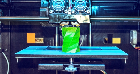 3D printer works and creates an object from the hot molten plastic close-up. Automatic three...