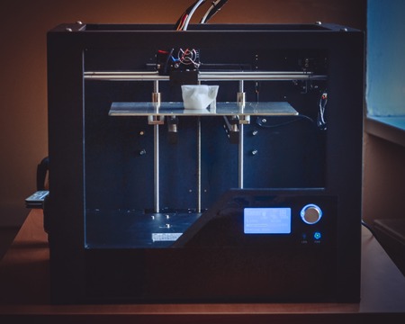 Objects printed by 3d printer. Automatic three dimensional 3d printer performs plastic modeling in...