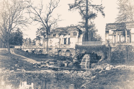 Vintage photo park with ancient ruins and a treeの写真素材