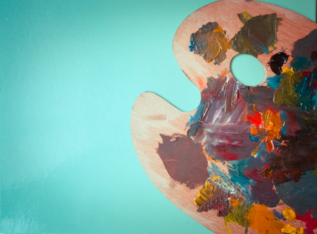 Isolated Palette with strokes of colors on a green backgroundの写真素材