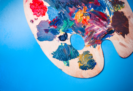 Isolated Palette with strokes of colors on a blue backgroundの写真素材