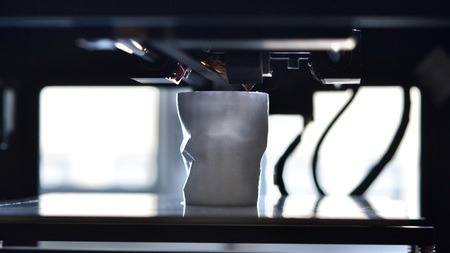 Objects printed by 3d printer. Automatic three dimensional 3d printer performs plastic modeling in laboratory. Progressive modern additive technologyの写真素材