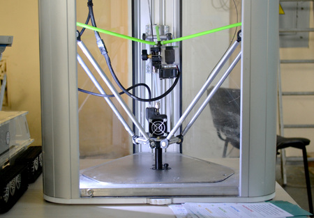 The process of working 3D printer and creating a three-dimensional object. Progressive modern...