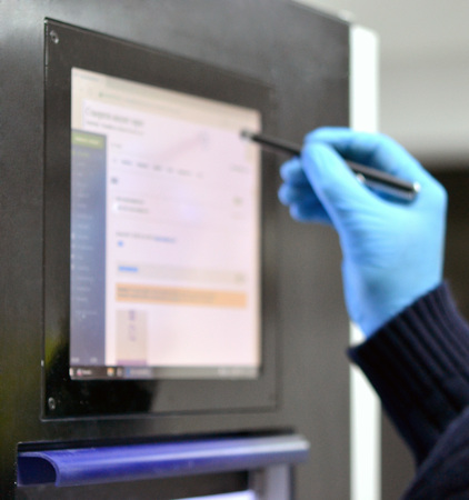The man works on the machine sensory monitor. Blurred backgroundの写真素材