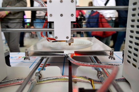 The process of working 3D printer and creating a three-dimensional object. Progressive modern...