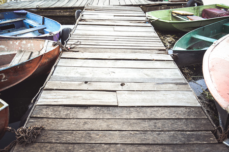 Wooden old dock And the noses of boatsの写真素材
