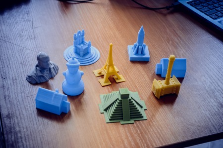 Bright objects printed by a 3d printer close-up. Automatic three dimensional 3d printer performs plastic modeling in laboratory. Progressive modern additive technologyの写真素材